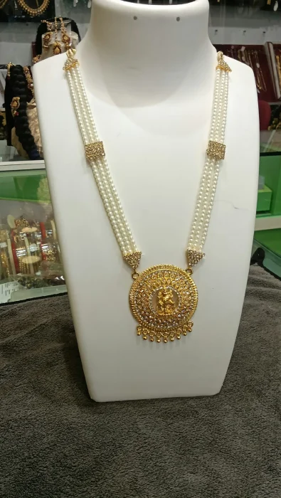 Accent Three Line White Beads Necklace with Lakshmi Pendent